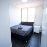 the goldminer deluxe studio bedroom with double bed