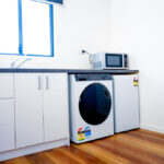 the goldminer accessible studio apartment laundry and kitchenette facilities